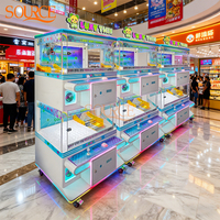 Machine à griffes à monnayeur pour quatre joueurs, jeu d'arcade attrape-poupées, excellent rapport qualité-prix pour centres commerciaux et salles de jeux