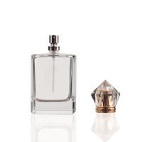 Ensemble complet de bouteille de parfum de rectangle clair en cristal de luxe de 100ml avec la boîte de présentation de pulvérisateur de pompe de fermeture en métal