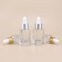 Bouteilles en verre cylindriques élégantes avec compte-gouttes, fond renforcé, finition mate, pour huiles essentielles et cosmétiques, 5ml, 10ml, 15ml, 30ml, avec emballage carton.