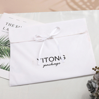 Sac de rangement pliable en velours doux avec logo personnalisé, fermeture à nœud en ruban blanc, pochette enveloppe en velours pour vêtements