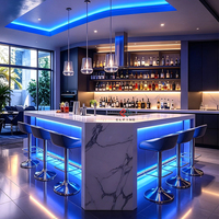 Meubles de fête de style décoration intérieure moderne avec éclairage LED coloré, comptoirs de bar au design tendance en marbre artificiel