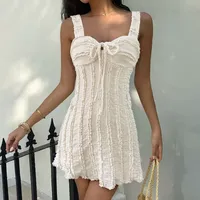 Robe mini moulante blanche sans manches avec détail de nœud pour les vacances d'été et la plage, emballage personnalisé en gros