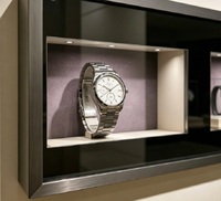 Vitrine murale de luxe en métal noir brossé pour montres, présentoir en verre haut de gamme pour montres et bijoux de luxe