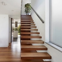 Escalier flottant moderne Tanlong en bois, à marches ouvertes, avec support dissimulé et marches en noyer et chêne