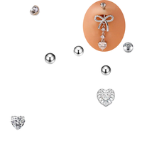 Piercing de nombril chic pour femme en acier inoxydable chirurgical 316 plaqué or rose avec zircon et nœud pendante serti griffe