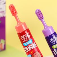Vente en gros de dentifrice liquide en tube à presser et à brosser, bonbons à la confiture, étiquette privée personnalisée, dentifrice en tube, bonbons au sucre, jouets pour enfants
