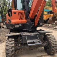 Excavatrice sur pneus Doosan DX60/150/200/150/210 d'occasion à vendre à SHANGHAI À BAS PRIX
