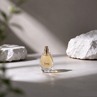 Flacon de parfum élégant en verre en forme de goutte d'eau avec bouchon en verre sphérique, col côtelé doré, livré avec du parfum liquide