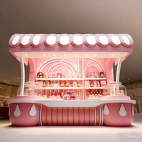 Airy Luxe Bakery & Coffee Market Stall Featuring Glass Display Case, Open Tiered Shelving, and Integrated Warm Lighting