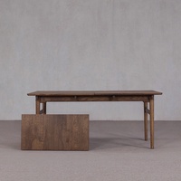 Table de salle à manger rectangulaire extensible en noyer foncé vieilli, avec structure robuste et design minimaliste, pour aménagement intérieur de villa et banquets