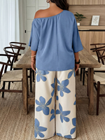Ensemble décontracté 2 pièces pour femme : haut à col rond et manches courtes, épaules dénudées, associé à un pantalon large à imprimé floral, tenue confortable et ample