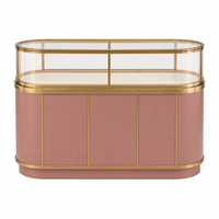 Comptoir de présentation de bijoux ovale rose personnalisé avec vitrine en verre incurvé et cadre doré pour la vente en gros aux bijouteries
