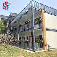 Maison conteneur préfabriquée à deux étages de haute qualité, en panneaux sandwich modulaires, à assemblage rapide, pour bureau moderne ou espace de vie