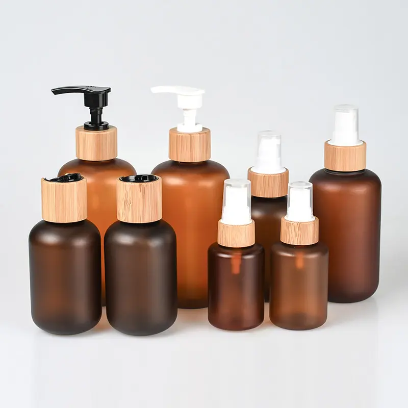 Eco-friendly cosmetic PET 30ml 60ml 120ml 250ml 500ml lotion frosted amber bottle with bamboo caps pump cap
