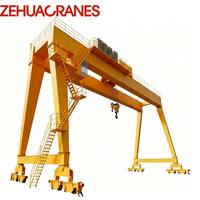Nouvelle Grue Portique à Double Poutre Lourde MG 2026 Montée sur Rail 10T-100T avec Crochets Principal et Auxiliaire, VFD Complet, FEM, CE, ISO, Moteur, Roulement