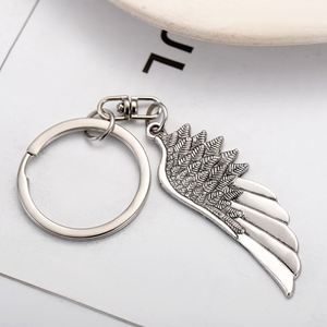 Porte-clés personnalisé rétro en alliage de zinc, style européen et américain, avec pendentif ailes d'ange à plume unique, accessoires de sac, vente en gros - Product Image 1