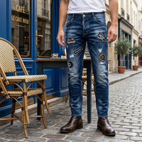 Nouveau Jean Streetwear Homme 2026 Taille Basse Bleu Vintage Slim en Denim avec Patchwork, Logos, Éclaboussures de Peinture et Détails Déchirés