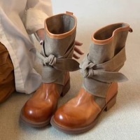 Nouvelle collection automne/hiver 2026 : Bottes d'équitation mi-mollet en cuir synthétique avec nœud papillon, style rétro et design de niche, pour femme, vente en gros et export.