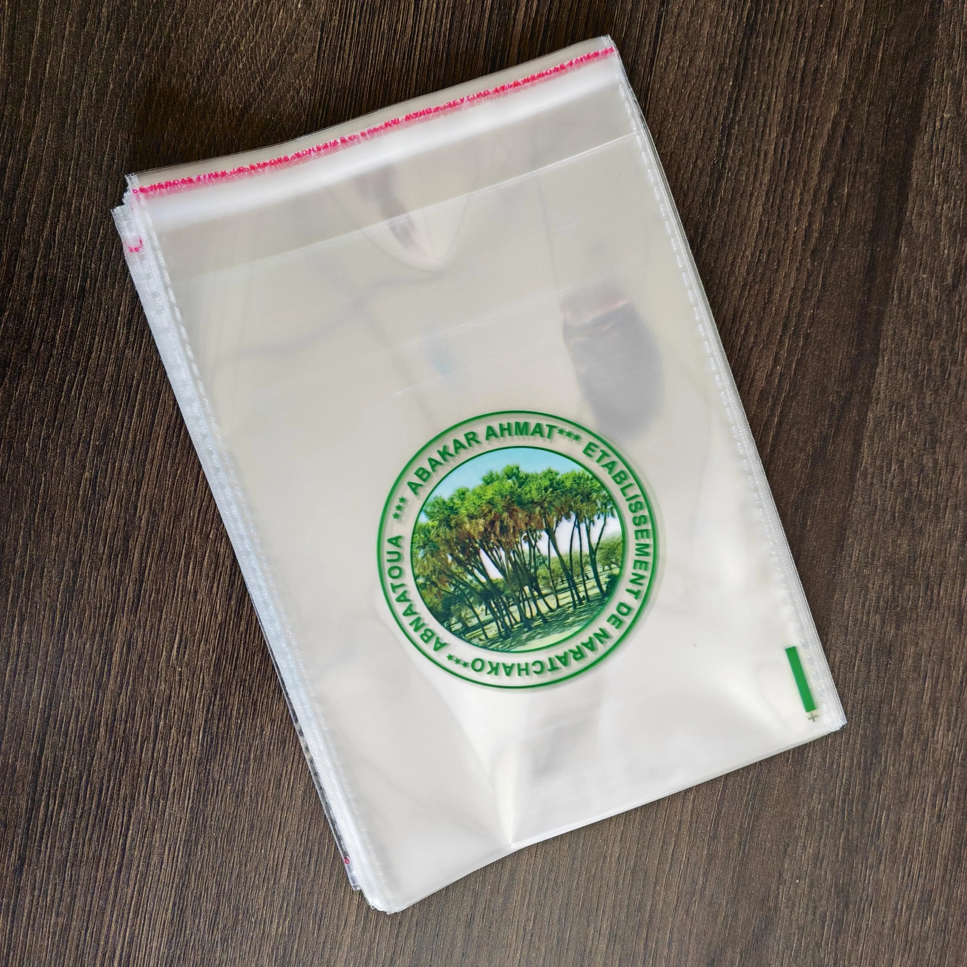 Custom cinque colori stampa logo trasparente sacchetto di cellophane merce trasparente OPP merce di plastica sacchetto di imballaggio