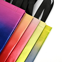 Sac fourre-tout promotionnel réutilisable en tissu non tissé recyclé écologique de luxe avec revêtement laser doré pour l'emballage des vêtements