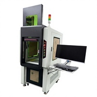 Machine de marquage laser à fibre avec un boîtier fermé et une palette de couleurs noir et blanc ; capable de graver le fer et l'aluminium