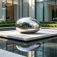 Sculpture de galets en acier inoxydable poli miroir sur mesure pour les jardins d'hôtels, les parcs de bureaux, les installations aquatiques et les places publiques