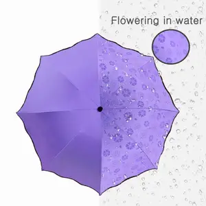 Parapluie pliant manuel portable fleurissant dans l'eau peut Logo personnalisé Mini parapluie UV léger enduit de colle noire pour les femmes