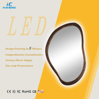 Miroir de salle de bain intelligent LED de forme irrégulière, design moderne encadré, à fixer au mur