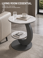 Table d'appoint moderne à deux niveaux avec plateau en dalle de roche et cadre en fer courbé pour salon, hôtel, entrée, chambre