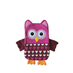 Hot water bottle with owl knitted cover