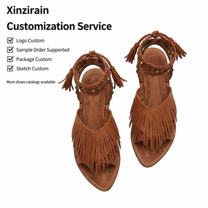 صنادل نسائية مسطحة كاجوال من Xinzirain بتصميم بوهيمي مخصص مع شراشيب من الجلد المدبوغ وحزام للكاحل مع تفاصيل معدنية - Product Image 1