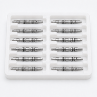 Bobine de vanne doseuse multi-canaux en acier inoxydable usinée CNC suisse sur mesure pour vannes doseuses pneumatiques et de fluides compactes