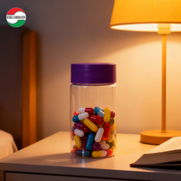 Bouteille en plastique PET ronde de qualité alimentaire écologique avec couvercle à vis coloré pour capsules, bonbons gélifiés, noix