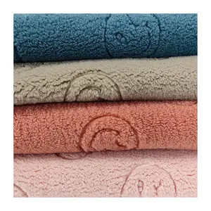 100% Polyester Sherpa Fabric Textile Warp Knitted Smilling Face Pattern  Embossed