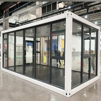Conteneur préfabriqué détachable Salle d'exposition Petite structure en acier Hall d'exposition Magasin de rue Cabine en verre Sunshine