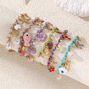 Pulsera Tejida Multicolor Hecha a Mano con Dijes de Oro de la Serie Océano: Estrella de Mar, Tortuga, Pez, Flor y Perla - Product Image 2