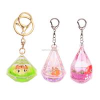 Nouveau design OEM ODM, vente en gros, porte-clés créatif personnalisé en acrylique avec mini liquide, flotteur marin en résine 3D, sable mouvant et paillettes en alliage