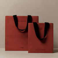 Maßgefertigte Luxus Orange Papiertüte mit Bandgriff Bedrucktes Logo Geschenkpapiertüte