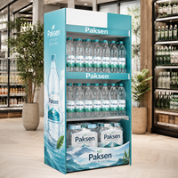Présentoir de sol en carton graphique pour bouteilles d'eau, idéal pour la promotion de l'eau minérale pétillante