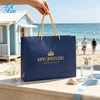 Sac de shopping de luxe en carton bleu marine avec logo personnalisé en feuille d'or, sac cadeau avec poignée en corde de coton, écologique, pour bijouterie et vente au détail