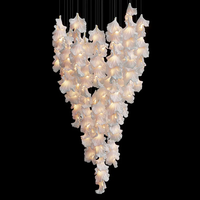 Lustre élégant en forme de fleur Luminaire suspendu en céramique de décoration de style nordique moderne pour hôtel