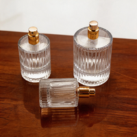 Vente en gros de flacons de parfum transparents à rayures verticales 10ml 30ml 40ml, design luxueux de haute qualité, flacon en verre avec vaporisateur, crème pour la peau, mascara