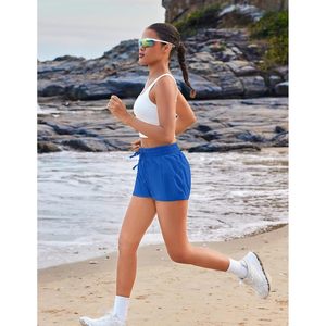 Pantalones cortos de running 2 en 1 para mujer FOXA con bolsillos interiores, pantalones cortos deportivos de secado rápido para entrenamiento y gimnasio, ligeros, de spandex y poliéster - Product Image 2