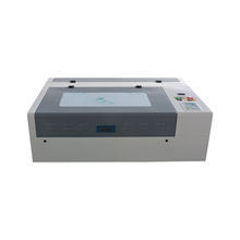 เครื่องแกะสลักและตัดด้วยเลเซอร์ CO2 แบบพกพา รุ่น 3020 มินิ พร้อมมอเตอร์กำลังไฟ 100 วัตต์ แรงดันไฟฟ้าคู่ 220V/110V - Product Image 3