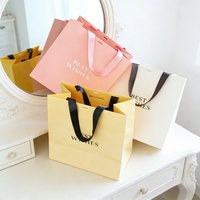 Sacs à vêtements en papier couché de luxe imprimés sur mesure, sacs de courses en carton blanc personnalisés, sacs en papier d'art fantaisie avec logo