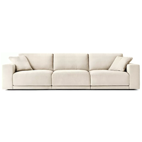 Canapé d'angle en tissu de luxe tendance pour salon, avec coussins moelleux faits à la main, mobilier d'intérieur pour villa