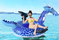 Vente en gros usine : Grand matelas flottant gonflable bleu en forme de dragon, animal de dessin animé à chevaucher pour fête aquatique estivale