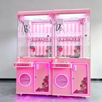Machine de jeu à griffes rose en gros avec vitrine transparente, griffe à trois branches, joystick et lumières LED
