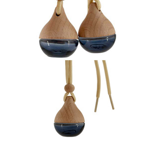 Flacon de parfum en verre vide en forme de goutte noire de 6 ml pour diffuseur d'arômes de voiture avec bouchon en bois - Product Image 1