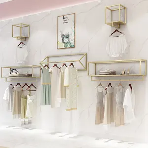 Popüler giyim mağazası ekran standı Female'S giyim altın duvar askısı kombinasyonu yan asılı teşhir rafı